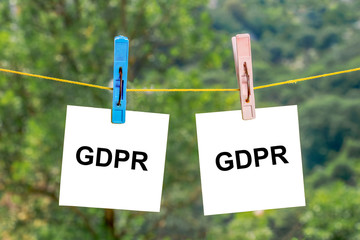 GDPR word on paper sheets hanging from a rope with clothespins