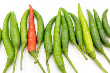 Green and red peppers isolated from white background.