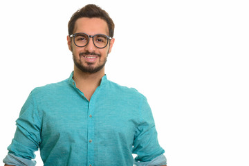 Young happy Indian man smiling and wearing eyeglasses