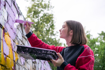 Street Artist Making a New Graffiti.