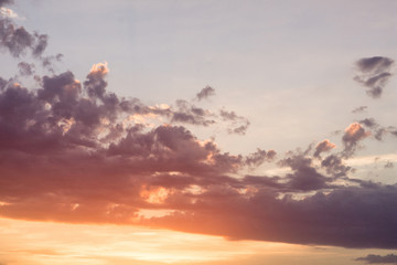 Beautiful landscape of the evening sky. The sunset of the autumn sun. Flying through clouds. Under the cloud.