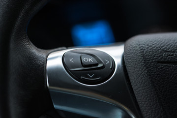 Display of audio system panel with media, phone, sound, radio and menu buttons. Modern car control panel with radio control and dial pad.  Control panel of a transport van. 