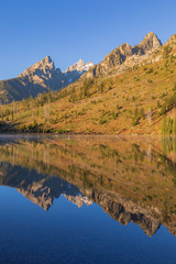 Fototapeta na wymiar Autumn Reflection of the Tetons in String Lake