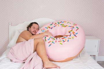 Funny man and donut. Diet. 