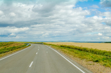 Summer. The road on wide open spaces