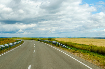 Summer. The road on wide open spaces-turn