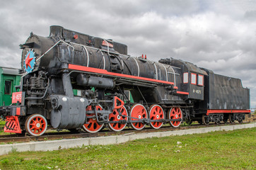 Fototapeta na wymiar The locomotive - a locomotive that runs with steam