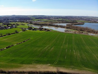 Aerial photo of a farmers field over looking a large lake