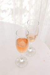 wine glasses on the white table. wedding organization details