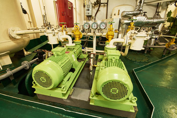 Panoramic view of electric motors on a merchant ship in the engine room
