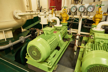 Panoramic view of electric motors on a merchant ship in the engine room