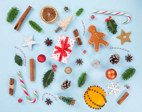 Christmas decorations on pastel color background. Top-down view.