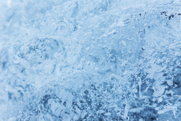 Fototapeta na wymiar Blue ice texture, winter background, texture of ice surface.