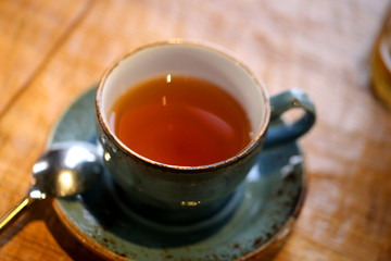 Macro photo of delicious bright tea with herbs