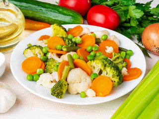 Mix of boiled vegetables, steam vegetables for dietary low-calorie diet. Broccoli, carrots, cauliflower, side view