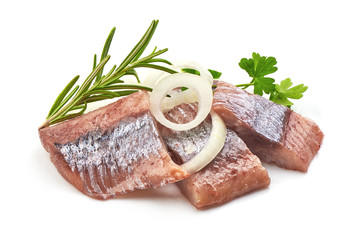 Atlantic salted herring fillet with onion ring and herbs, isolated on a white background