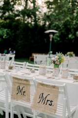 Mr and Mrs wedding ceremony setup flowers