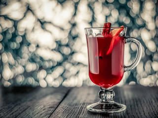 Glass of mulled wine on a blurred background