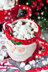 Cup of creamy hot chocolate with melted marshmallows