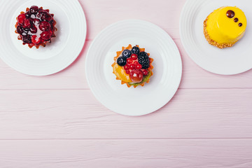 Composition of three delicious desserts tartlets
