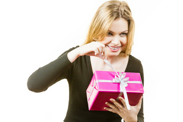 Curious woman holding gift box