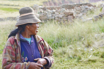 Serious old native american woman in the countryside.