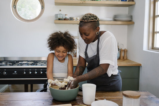 Mother and daughter baking