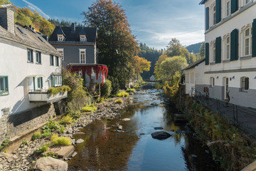 Fototapeta na wymiar Picturesque houses along the Rur River in the historic center of Monschau, Aachen, Germany