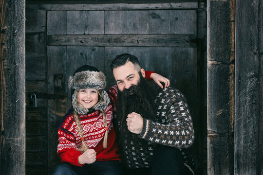 Happy Outdoor Portrait of Bearded Hipster Father Posing With Blo