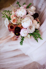 wedding bouquet with rose bush, Ranunculus asiaticus as a background