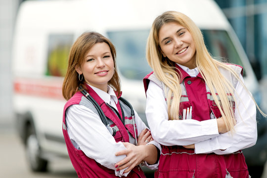 Emergency Medicine. Doctor with colleague paramedic on ambulance car background