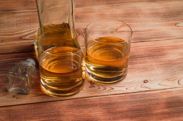 Glasses for whiskey on a wooden table