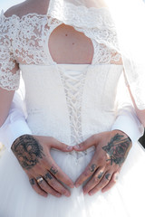 Modern stylish wedding. Bride and groom with tattoos