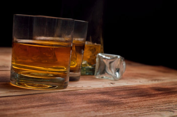 Glasses for whiskey on a wooden table