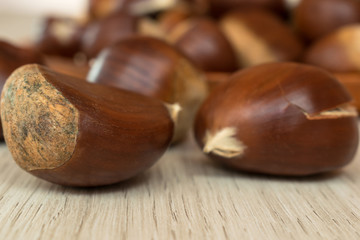 chestnut close-up with unfocused background on a wooden table