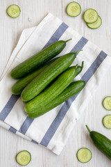 Fresh raw organic green cucumbers, overhead view. Flat lay,  from above, top view.