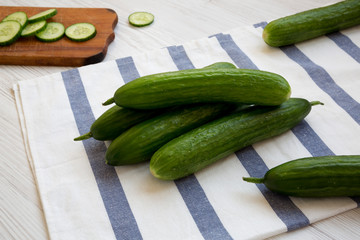 Fresh raw organic green cucumbers, side view. Close-up.