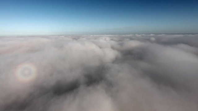 aerial view, flying through clouds at sunset 4k