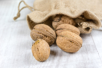 Fresh walnuts in a burlap bag. Garden harvest. Healthy food.