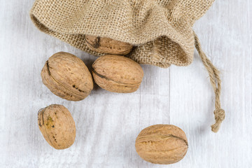 Fresh walnuts in a burlap bag. Garden harvest. Healthy food.