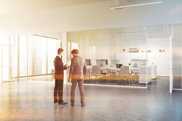 Fototapeta premium White office lobby with glass wall, people