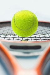 Closeup on ball on a tennis racket