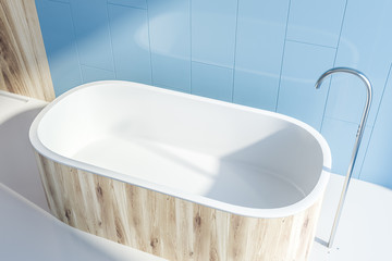 Top view of wooden tub in blue bathroom