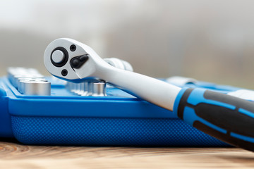 A set of heads in a blue box is not a focal point or a ratchet close-up. shallow depth of cut....