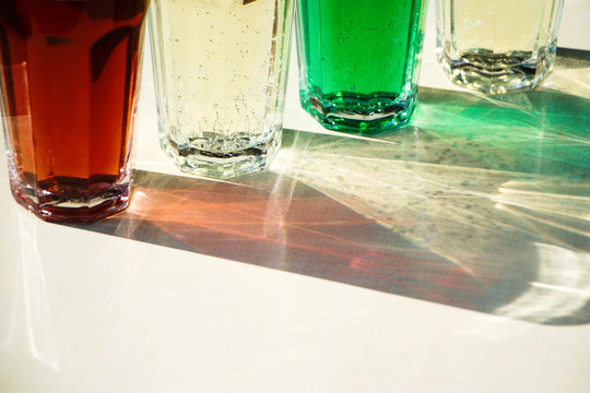Close up of colorful lemonade drinks in glass