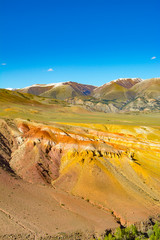 Mars mountains, the name of colored mountain protrusions in the mountains of Kyzyl-Chin. Altai, Russia. A delightful landscape of unreal beauty.