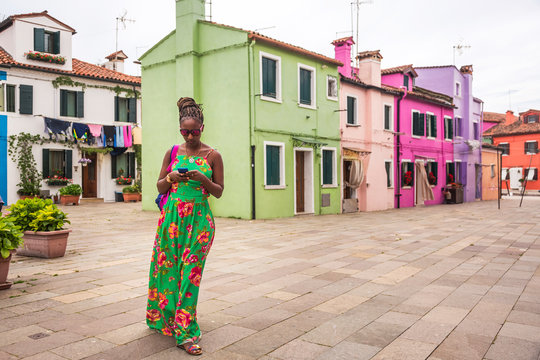 Woman visiting Burano, Venice, Italy.