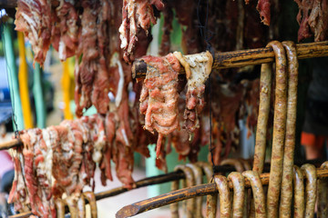 Original Caribbean food on the roadside in the Dominican Republic. Smoked pork, morcillas and...