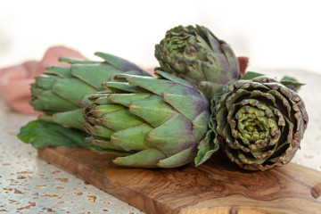 Traditional Italian food, fresh green artichoke vegetables, new harvest, uncooked