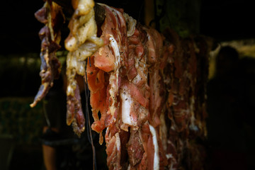 Original Caribbean food on the roadside in the Dominican Republic. Smoked pork, morcillas and...